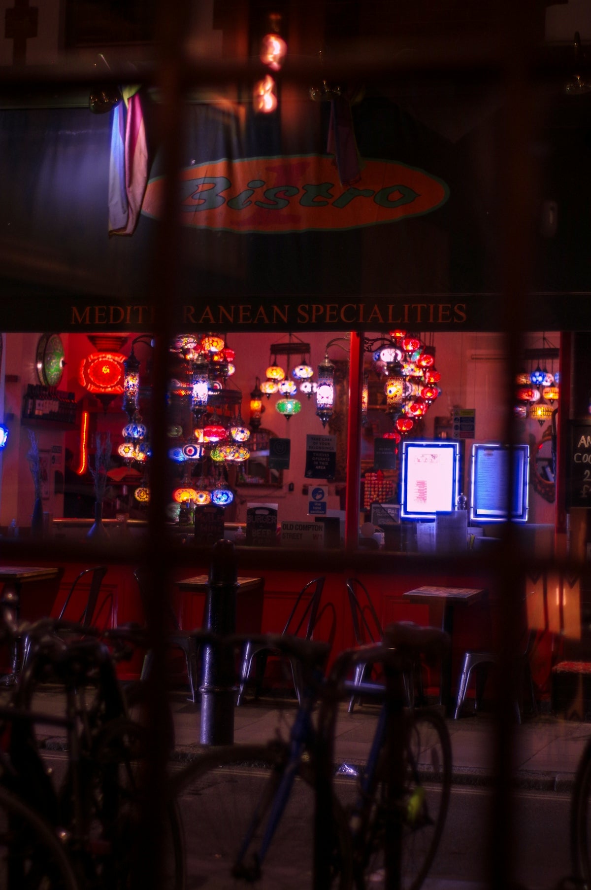 a restaurant with bikes parked outside of it