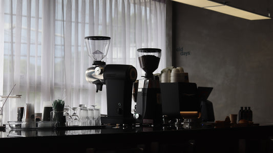 a coffee maker sitting on top of a counter next to a window